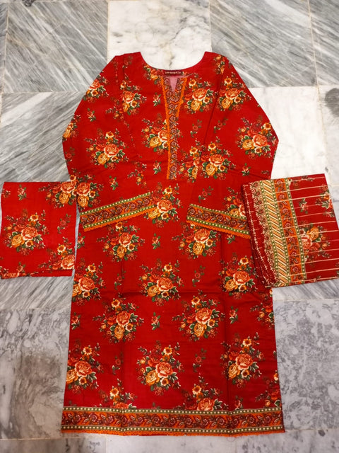 Red floral patterned fabric on a marble floor